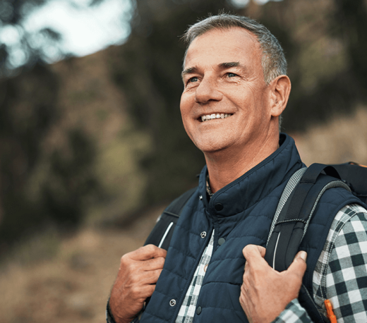 mature man smiling outdoors
